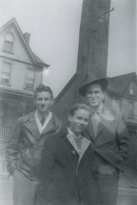 Brothers John, Andy, and Paul Warhola photographed near their home on Dawson Street in Pittsburgh, 1942.