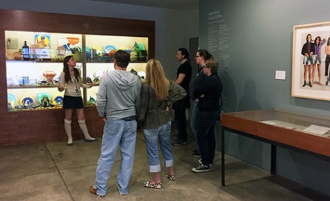 An exhibit educator leads visitors on a tour of the museum.