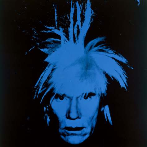 Andy Warhol's blue face stares intently out of a dark background in this print, his hair spiked up dramatically.