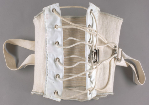 One of Andy Warhol's corsets, made of soft beige fabric and able to be laced up.