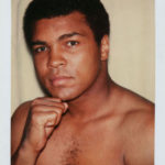 Polaroid of boxer Muhammed Ali with his fist lifted to his chin, taken by Andy Warhol in 1977.