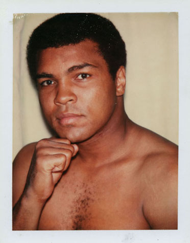 Polaroid of boxer Muhammed Ali with his fist lifted to his chin, taken by Andy Warhol in 1977.