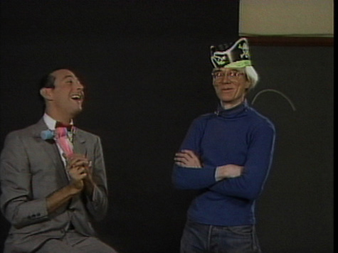 Still from a season two episode of Andy Warhol's tv, featuring comedian Paul Reubens as Pee Wee Herman.