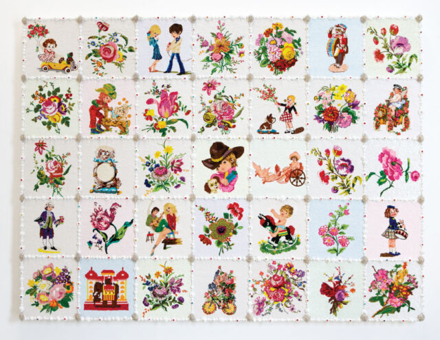 Artwork resembles a lush white layer cake with frosted borders and decorative toppings. Close inspection also reveals the elaborate beadwork used to construct a menagerie of images sourced from vintage postcards: sweethearts in love, domesticated animals, and exotic flower arrangements.