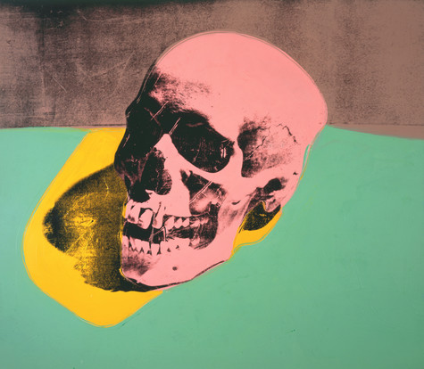A screen print of a pink skull on a green surface. The shadow the skull is overlaid with yellow.
