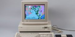 An old Amiga computer with a colorful self portrait of Andy Warhol on the screen