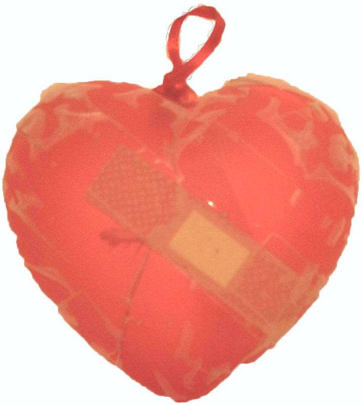 A red toy heart with a bandage and paper-mache covering it.