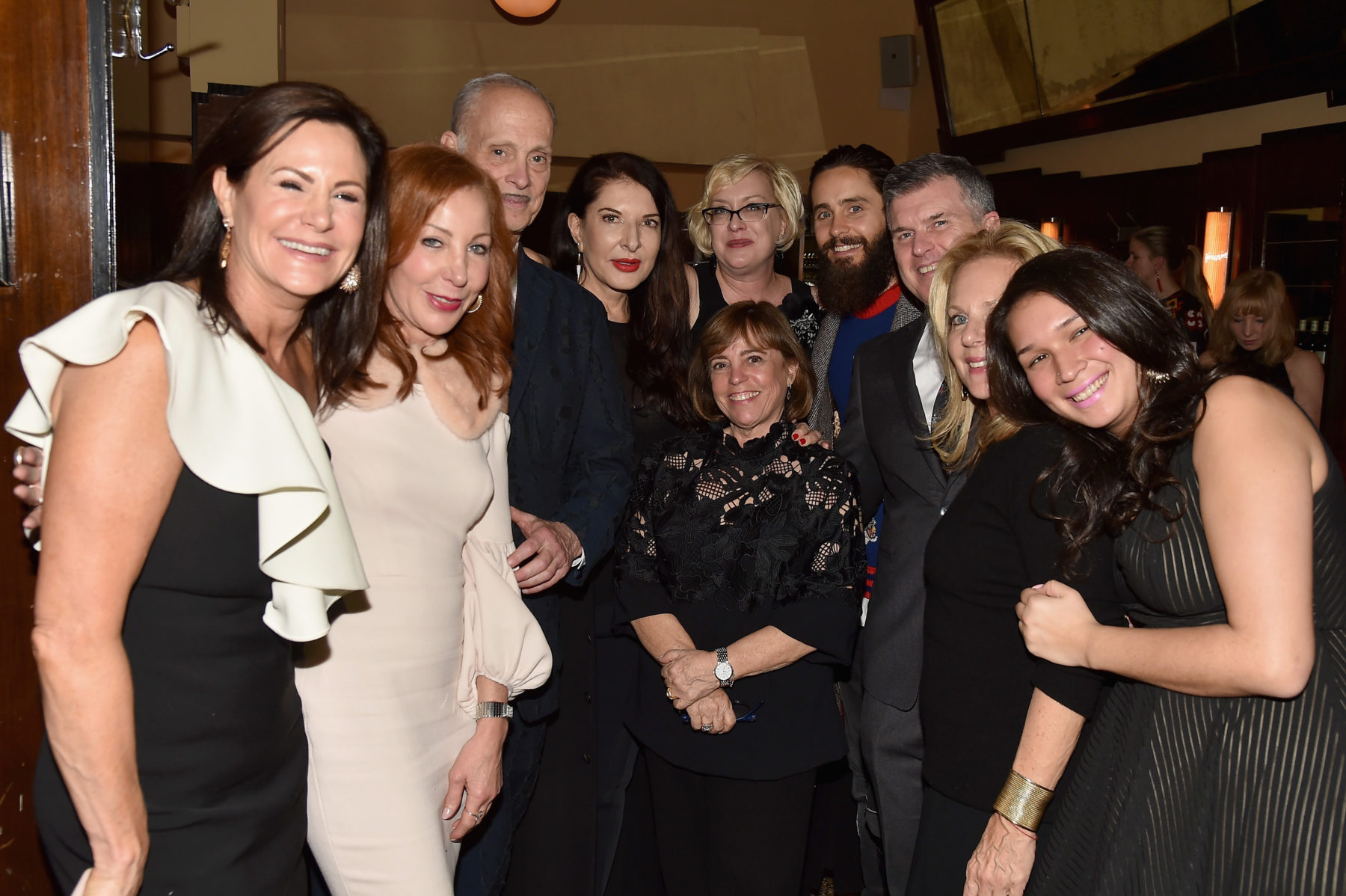 Board and staff members pose with John Waters, Marina Abramovic, Jared Leto, and friends at the 2018 New York City dinner fundraiser.