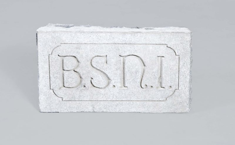 Front view of cornerstone that reads “B.S.N.I.”