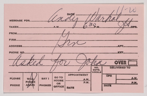 A pale pink pre-printed telephone message card with handwritten information about a call received on November 20, from an indecipherable caller who asked for John.