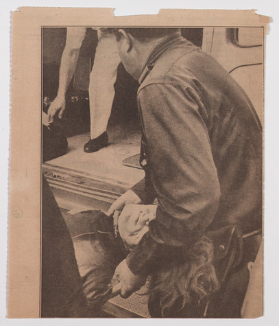 A newspaper clipping from The New York Daily News on June 4th, 1968 showing Andy Warhol being lifted into an ambulance after being shot.