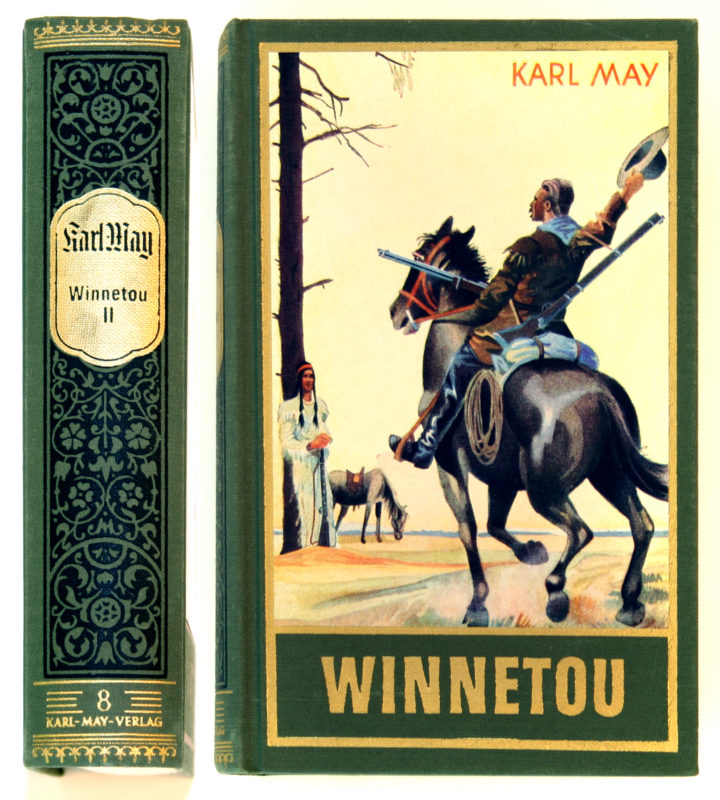 Front view of the second volume of the Winnetou book tetralogy. The cover image is an illustration of a man on horseback and another man standing against a bare tree.