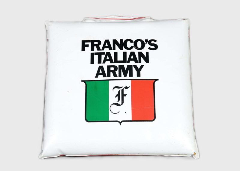 Front view of white seat cushion screen-printed with Franco’s Italian Army logo