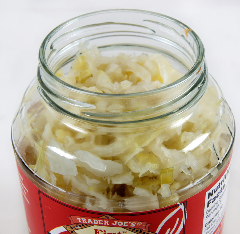 An image of an open jar of sauerkraut.