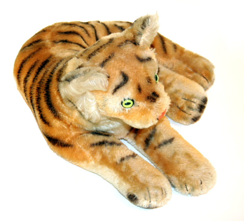 Side view of Stuffed Tiger. In this view, the tiger faces diagonally down to the right of the camera.