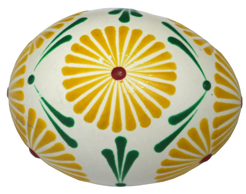 White egg with yellow blooming design with green and red accents.