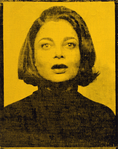 A screenprint of a person from the chest up in black paint on a yellow canvas.