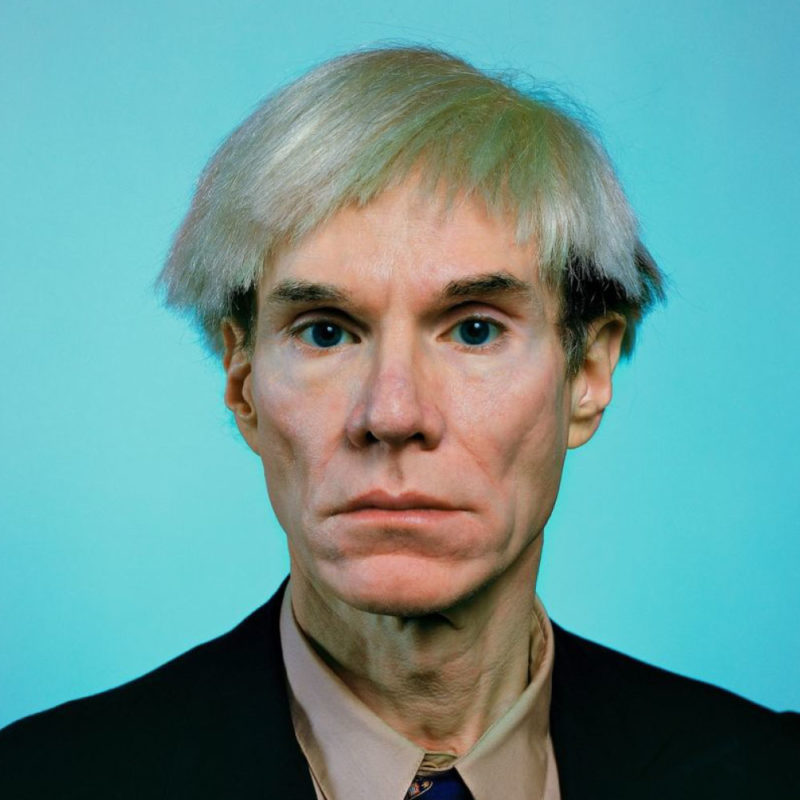 Late-career Andy Warhol poses for a portrait