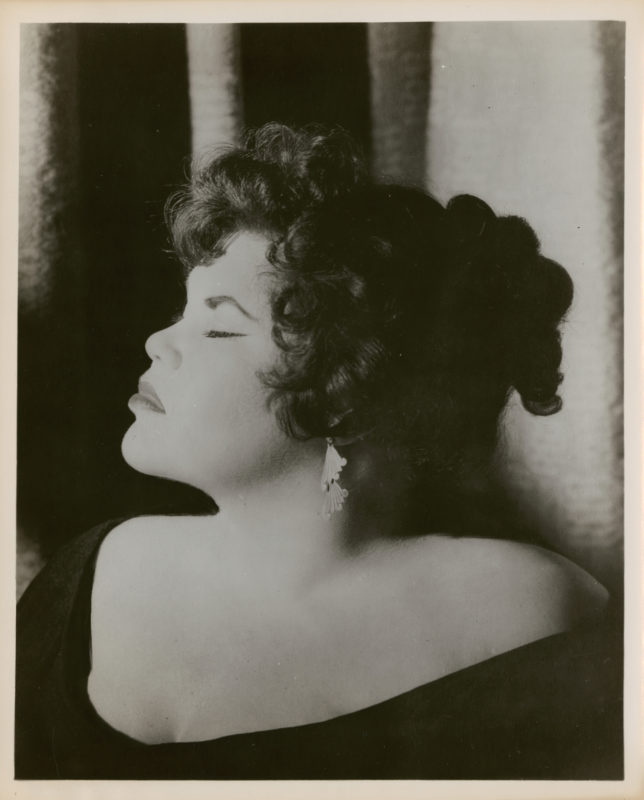 Black and white portrait photograph of Tally Brown with eyes closed, head turned to the viewer's left