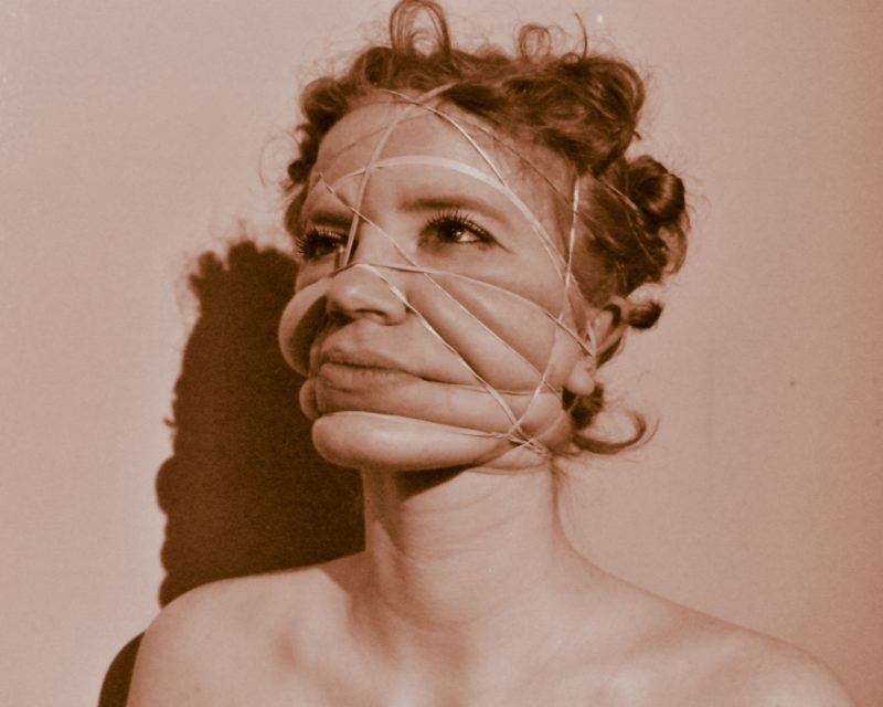 Sepia toned images of a person with string around their face