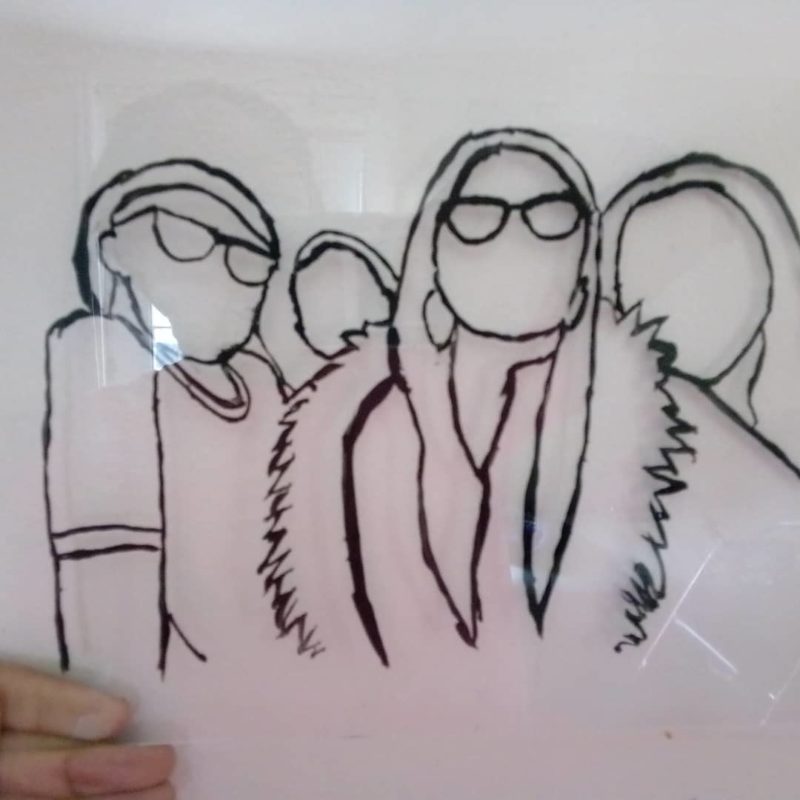 A black line drawing of a group of people