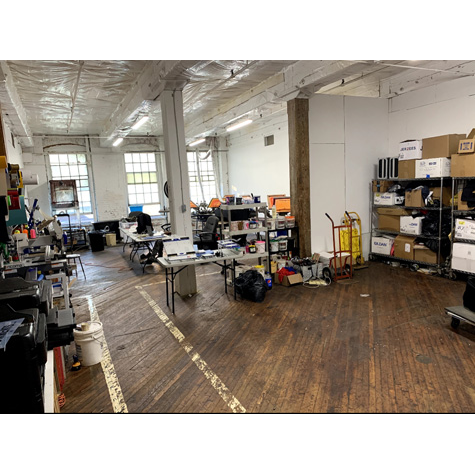 Image of a large, spacious screen printing shop.