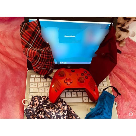 An open laptop with masks on it