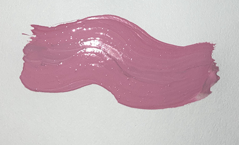 A pink wave of glossy lipstick