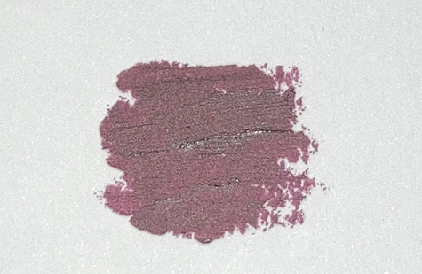 A dark purple lipstick smudge