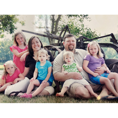 Photo of a man and woman and their kids