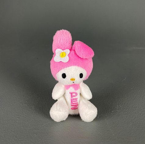 A pez candy dispenser of a bunny wearing a pink hat