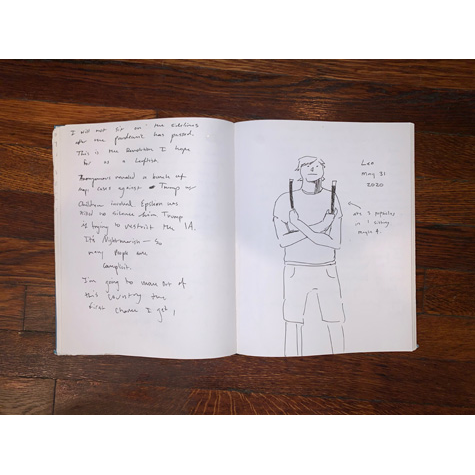 An open journal with drawing and writing