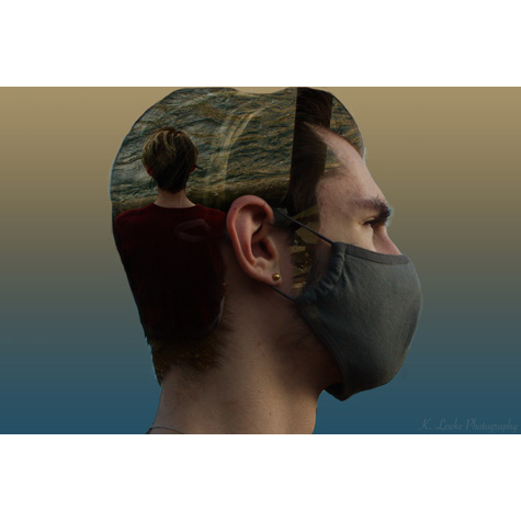 A profile of a man wearing a mask with an image of a woman projected on his head