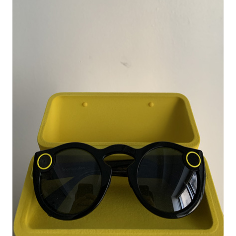 Sunglasses with two yellow circles on them