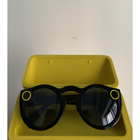 Sunglasses with two yellow circles on them