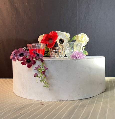 A still life of a skull and flowers