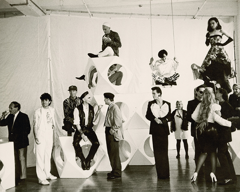 Group of men and women preparing to pose for a group photo.