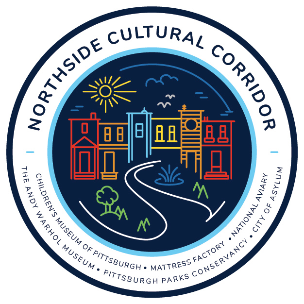 A circle Northside Cultural Corridor logo that includes a graphic of houses outlined in various colors with a sky, sun, clouds, and a walkway with trees and fountains around it. The names of the participating organizations are listed in the bottom half of the circle.