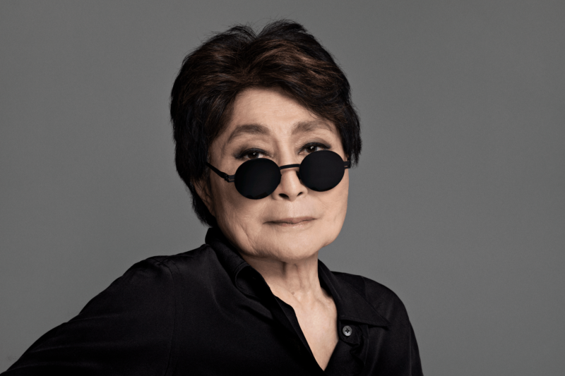 Portrait of a woman in black shirt, black sunglasses, and dark hair.