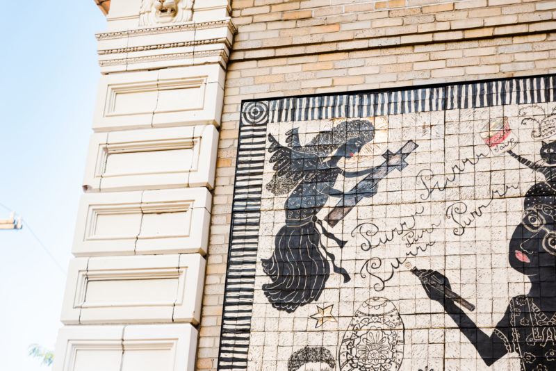 Artist Laura Jean McLaughlin's carved porcelain tile mural is visible on the back of the museum's facade.