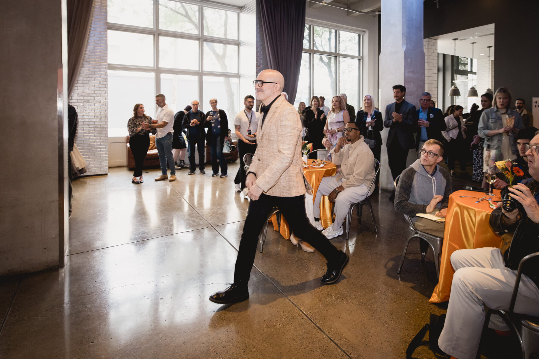Mario R. Rossero Striding forward in The Warhol's lobby