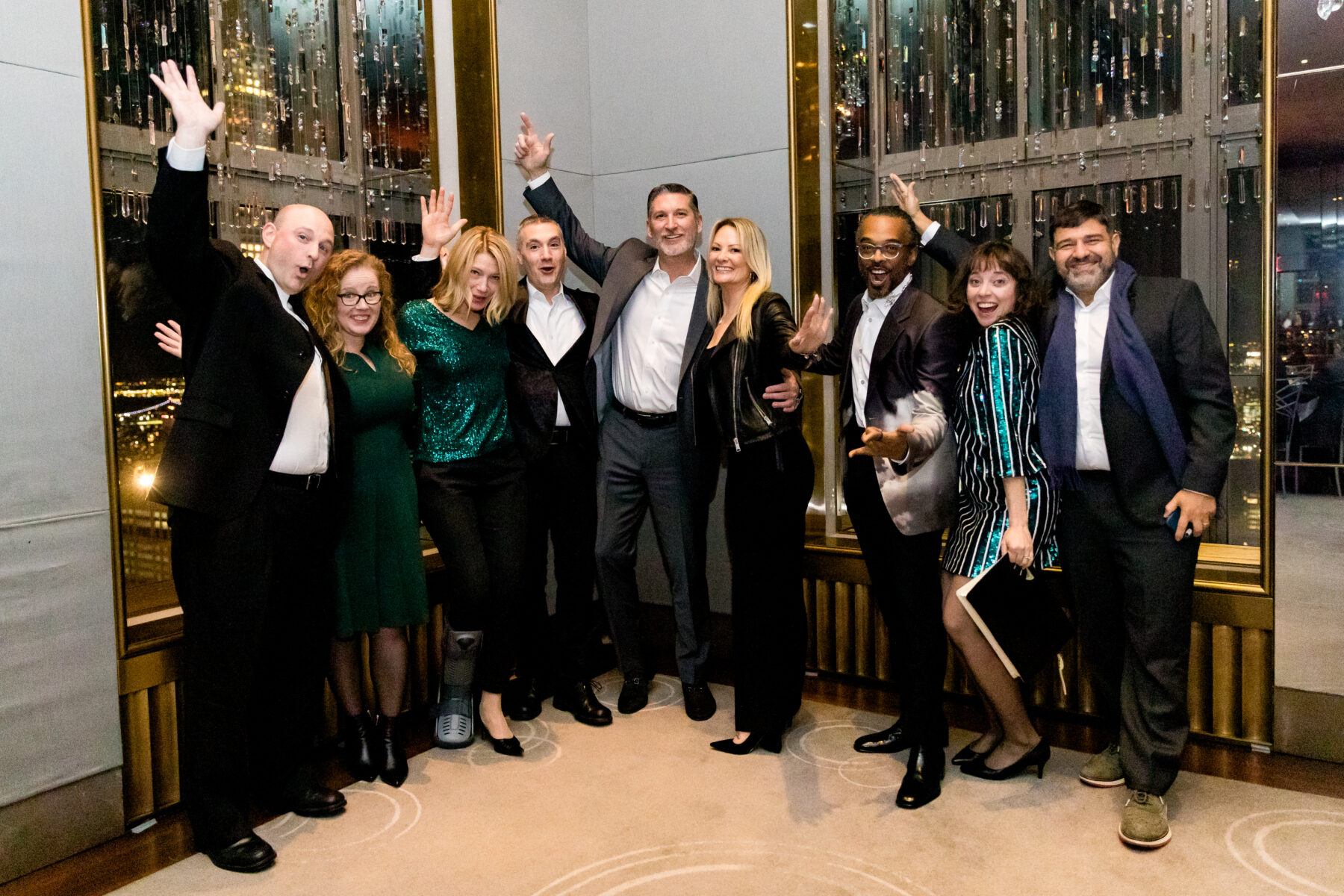 9 people pose for a group photo