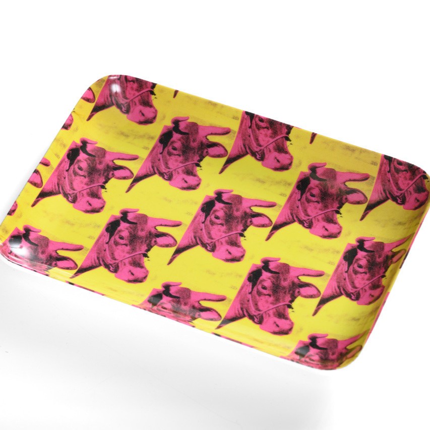 Pink cow on yellow wallpaper art by Andy Warhol, printed on a rounded edge trinket tray