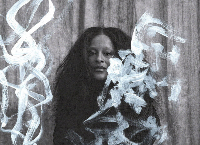 A person with long, textured hair, surrounded by artistic white brushstrokes on a gray background.